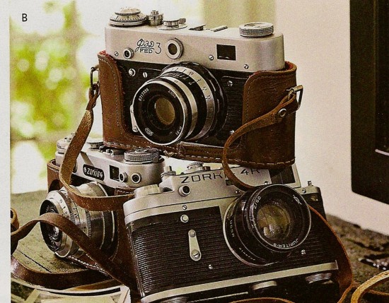 Three vintage cameras stacked on each other